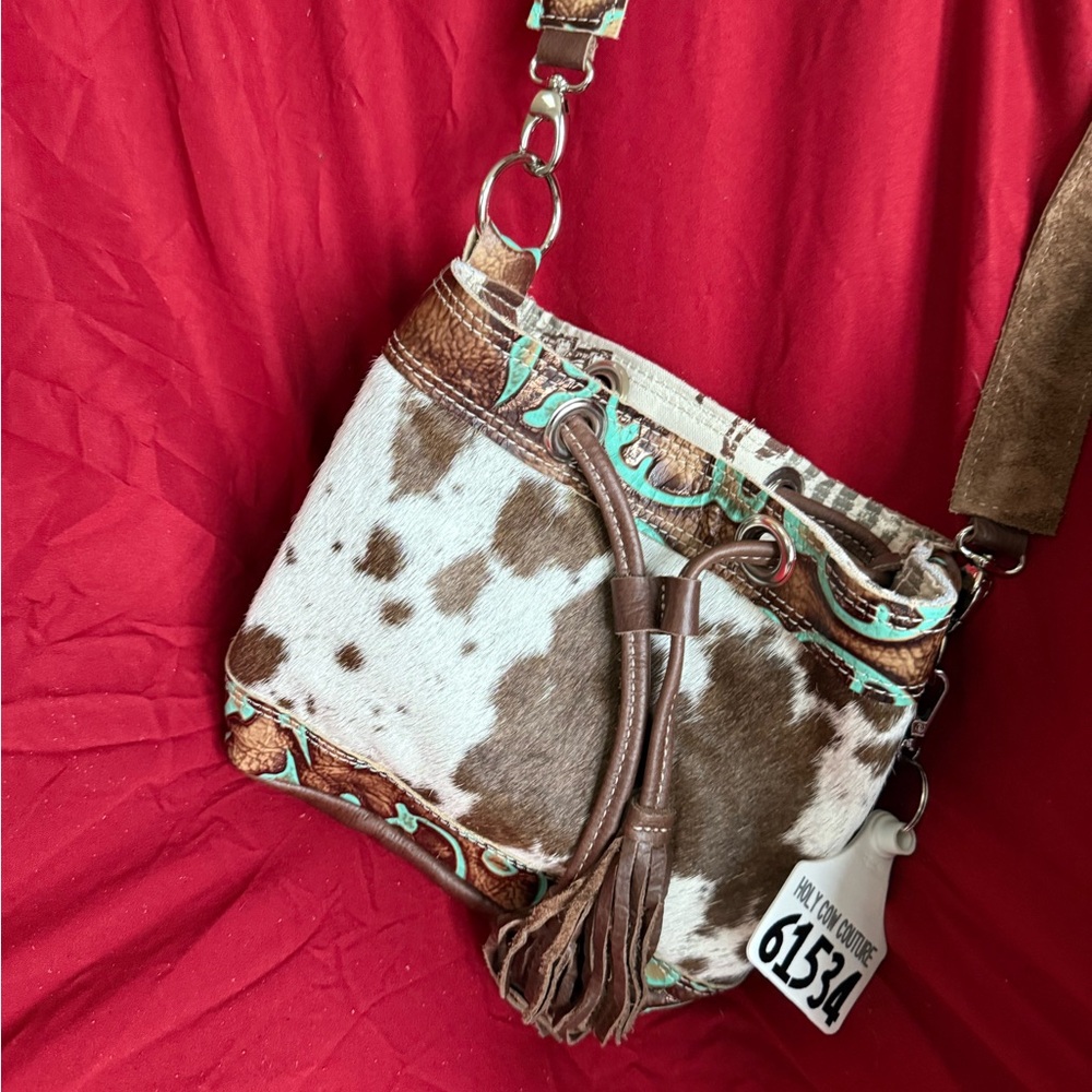 Holy Cow Mini Feed Bucket $200 Cowhide brown and white Crossbody Bag with Tassel